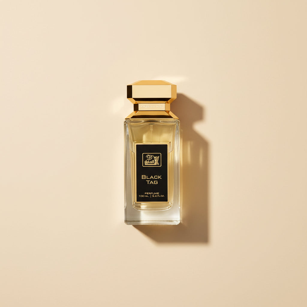 Perfume bottle labeled 'Black Tag' with gold cap on a white background