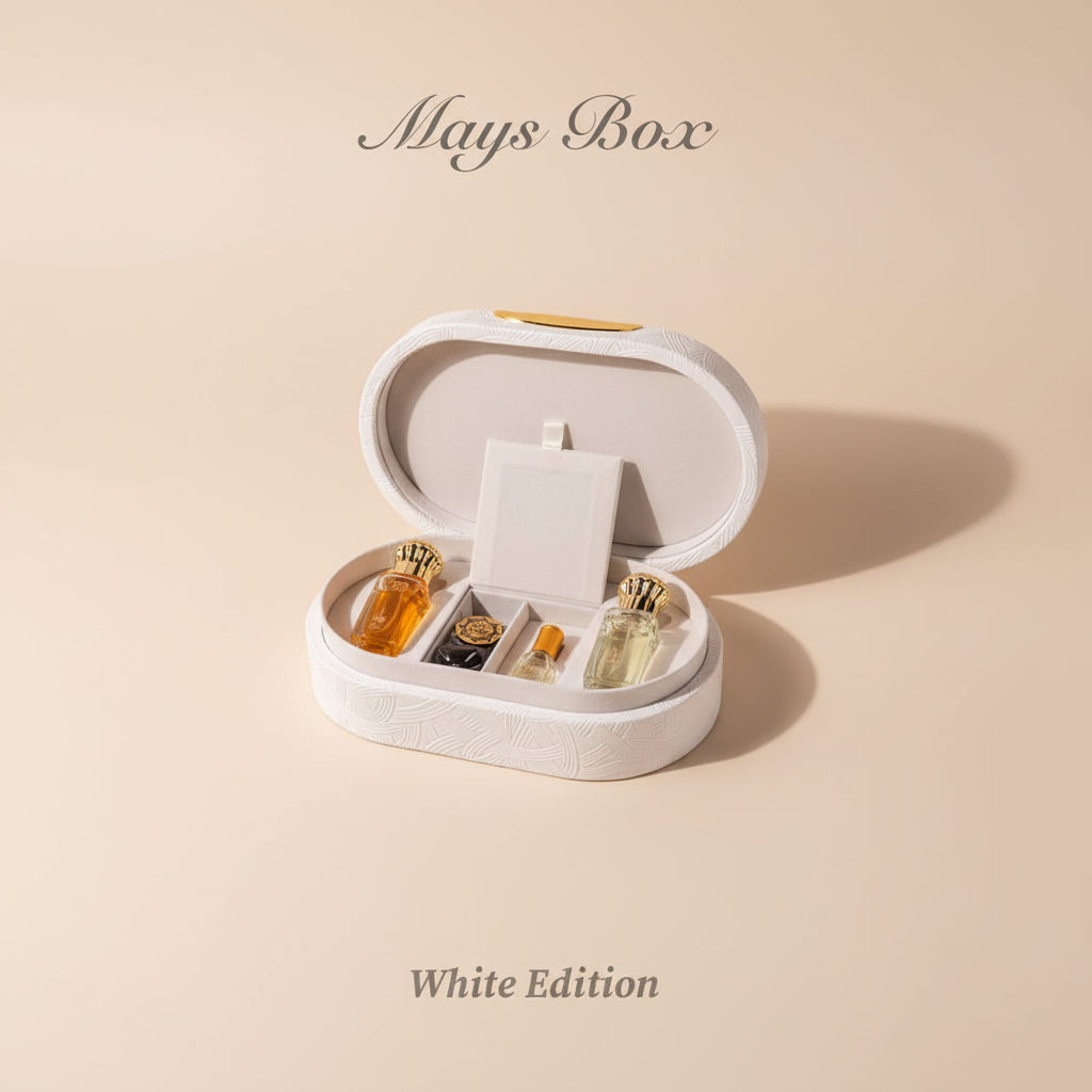 Heart-shaped jewelry box with gold and silver items on a white background, branded 'Mays Box'.