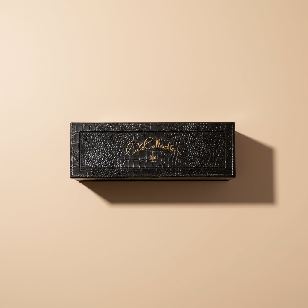 Set of small bottles in a black textured box with 'Saray' branding on a dark background