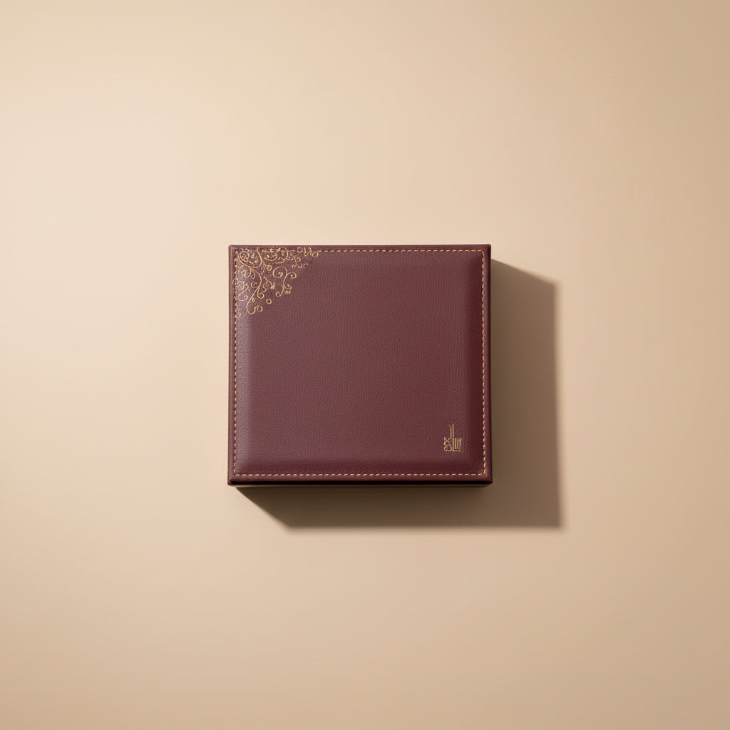 Collection of perfume bottles in a high-end leather box on a reflective surface with a gradient background.