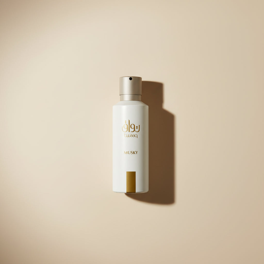 White bottle with gold text and accents on a reflective surface with a patterned background