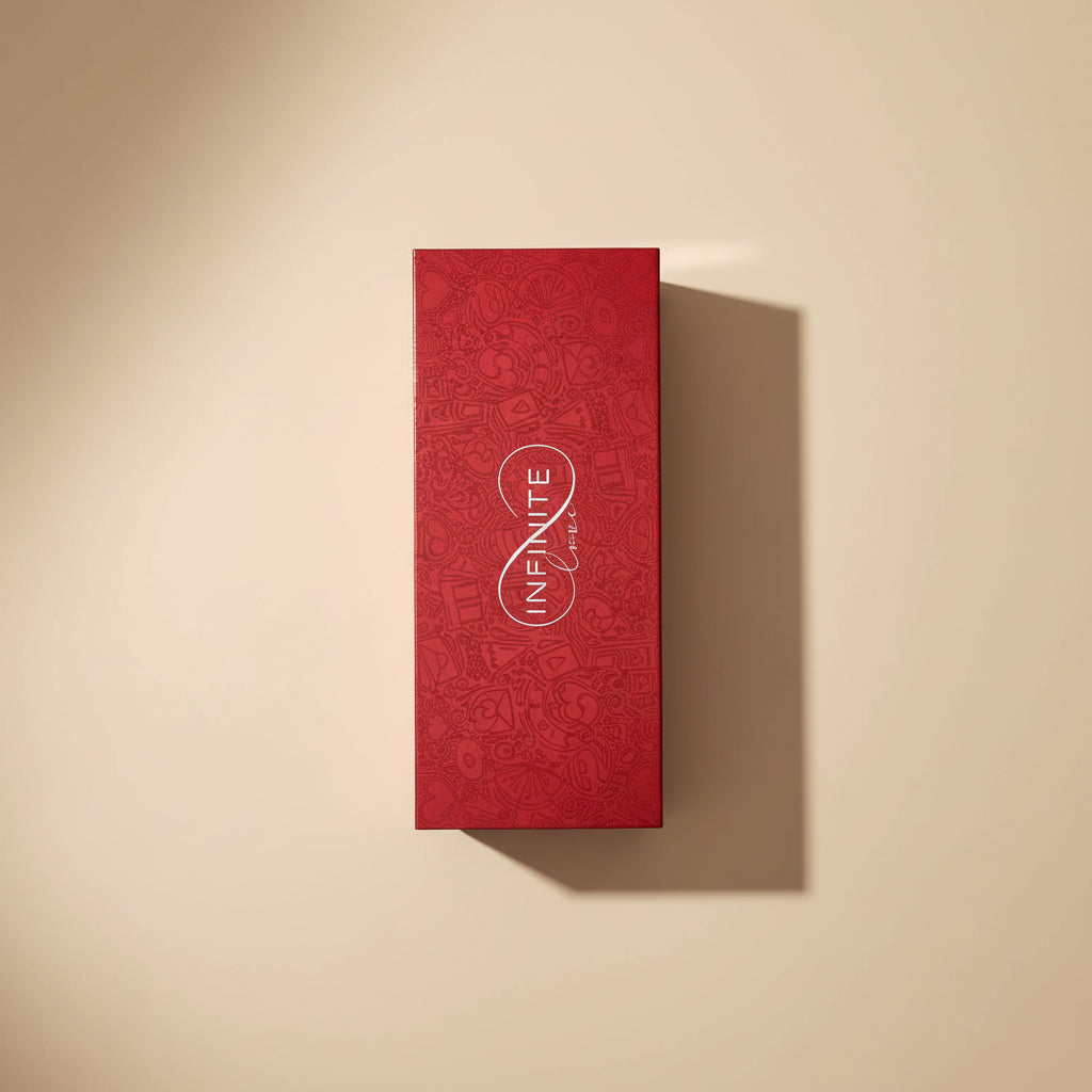 Red perfume box with 'Invicta' branding on a white surface.
