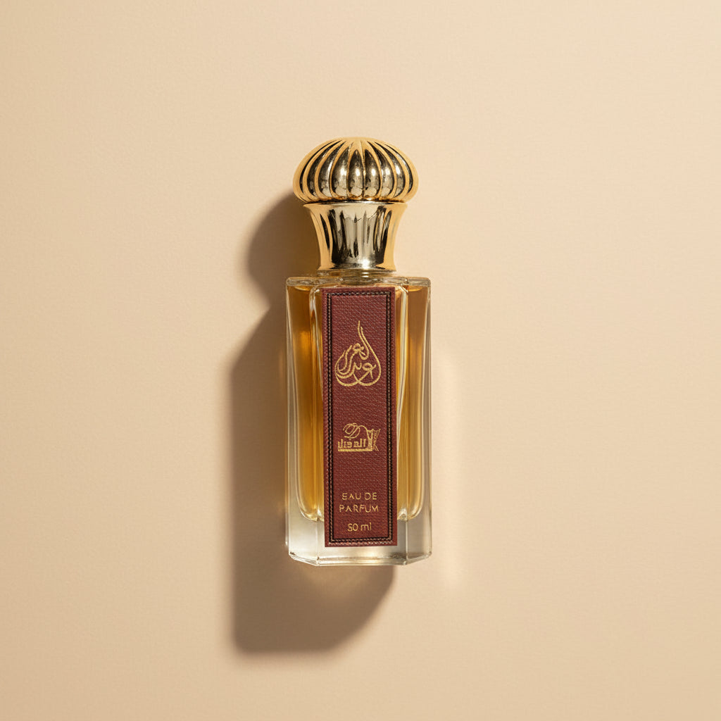 Perfume bottle with gold cap and brown label on a white background