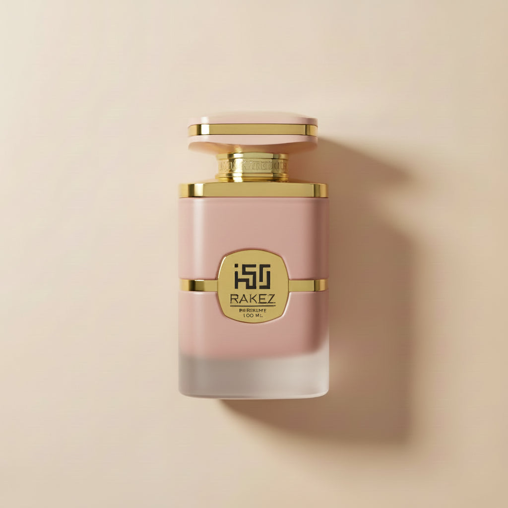 Perfume bottle with gold cap and 'Rakez' branding on a white background