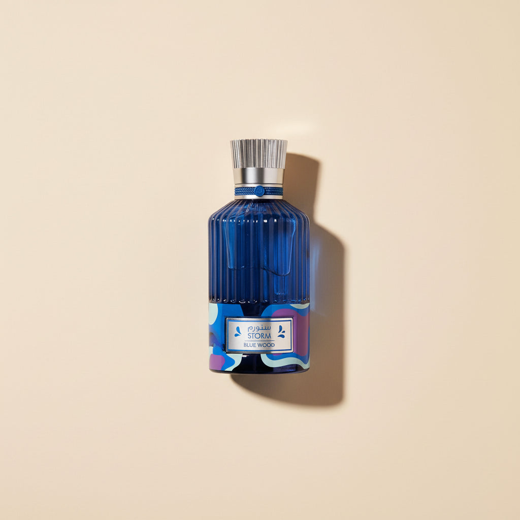 Blue perfume bottle with a silver cap on a white background