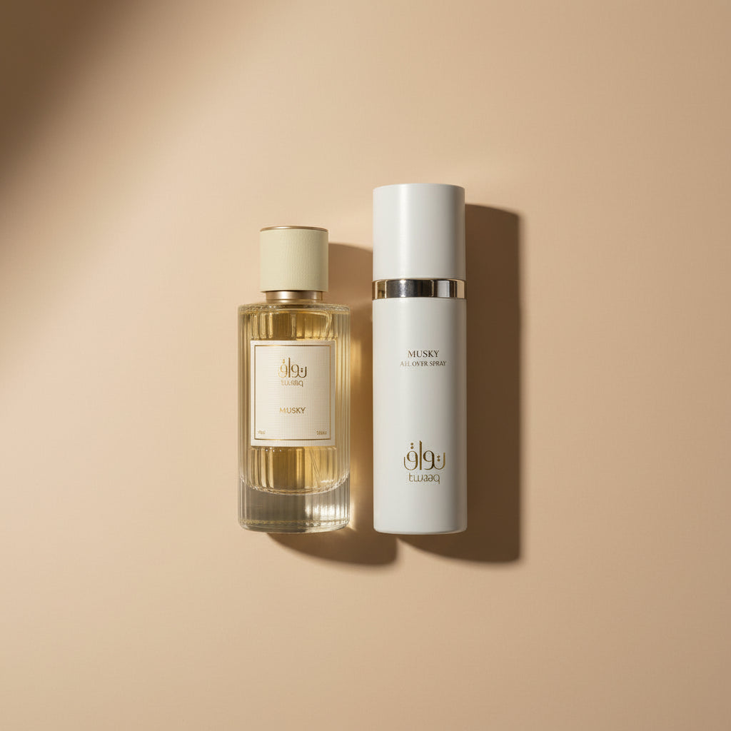 Two perfume bottles, one with a yellow cap and the other with a white cap, on a light surface.