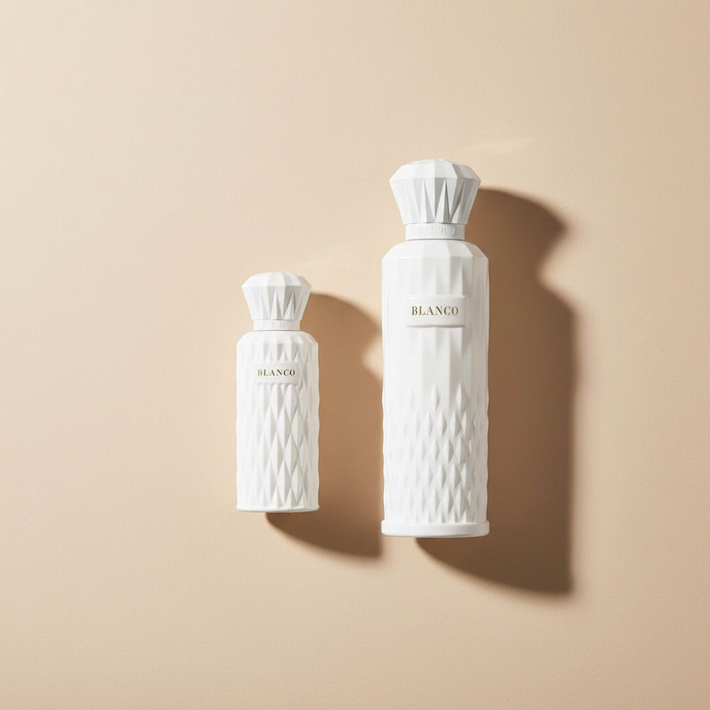 Two Blanco perfume bottles with a decorative box on a white background
