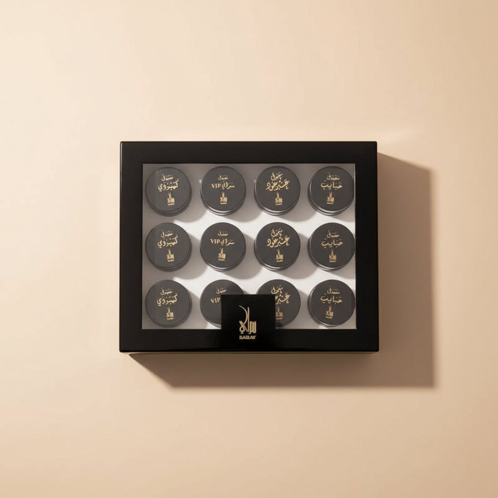 Set of black containers with gold text in a black box on a white background