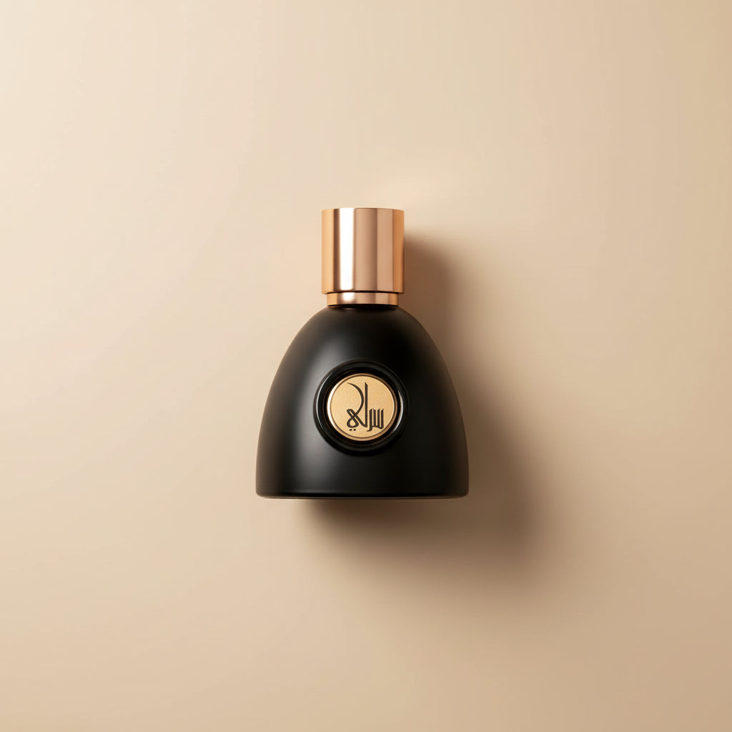 Black perfume bottle with gold cap on a white background