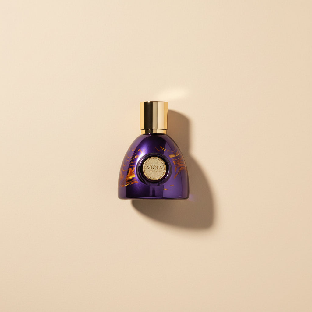 Purple perfume bottle with gold cap on a white background