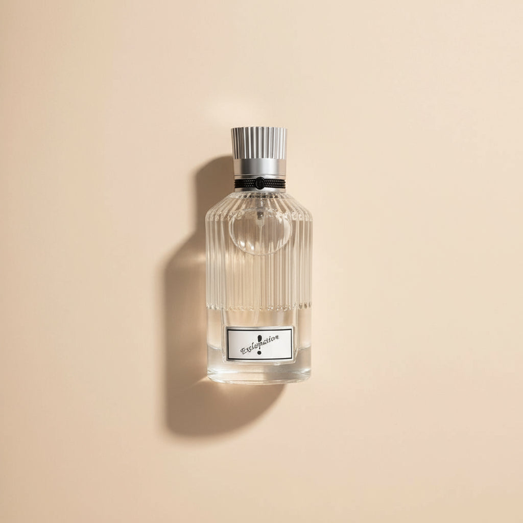 Clear perfume bottle with silver cap on a white background