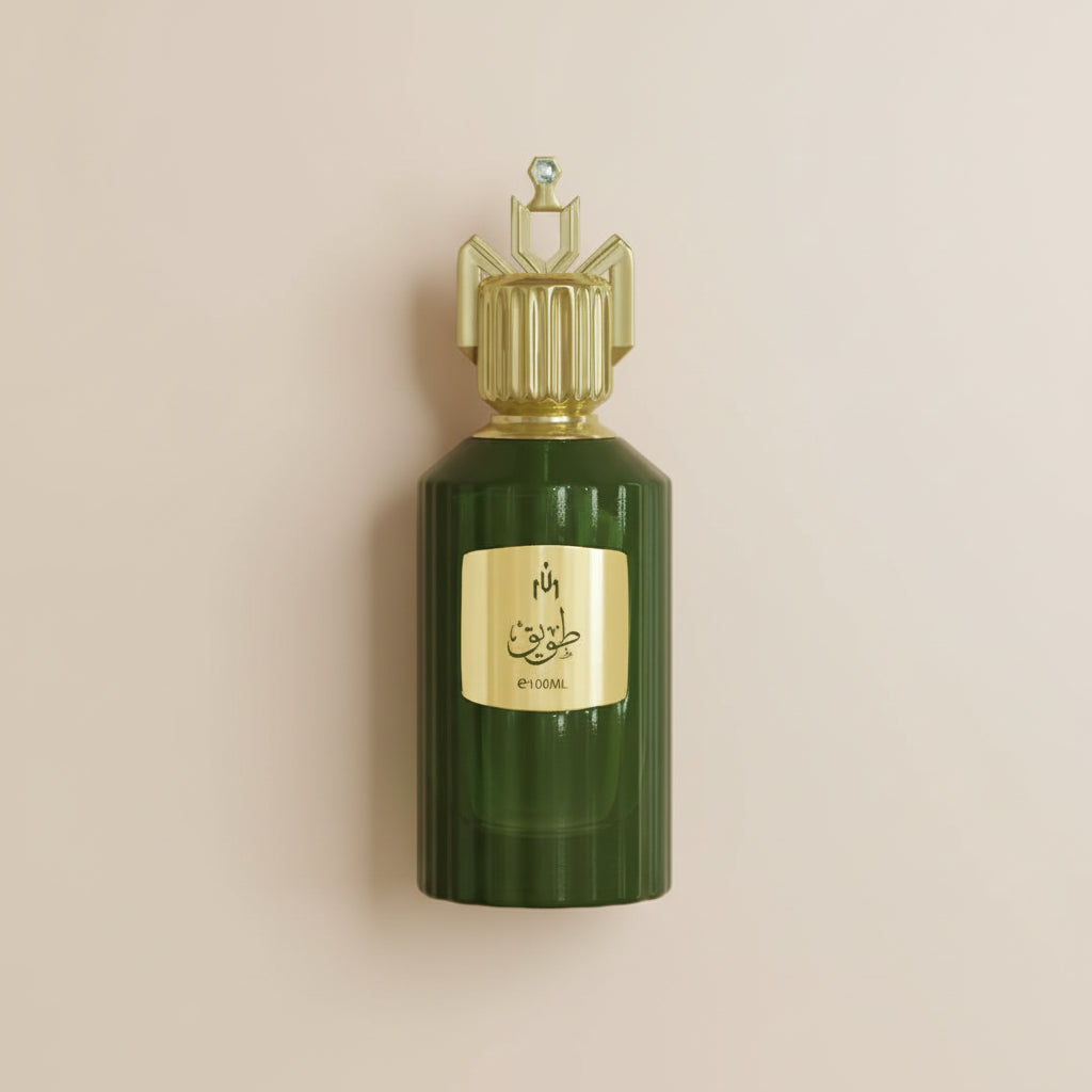 Green perfume bottle with gold cap on a white background