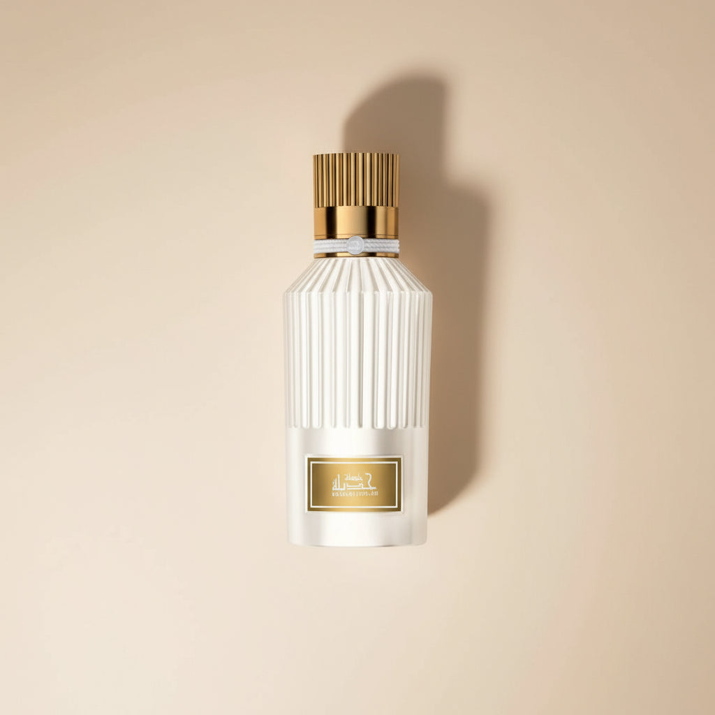 Perfume bottle with gold cap and label on a white background